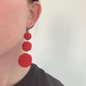Red statement earrings